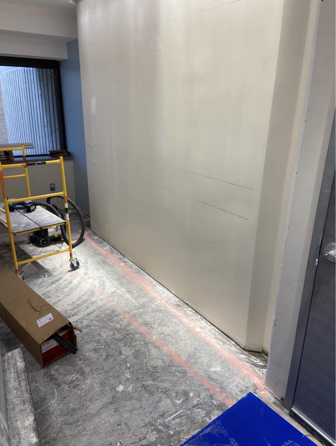 Fresh drywall board installed on a wall