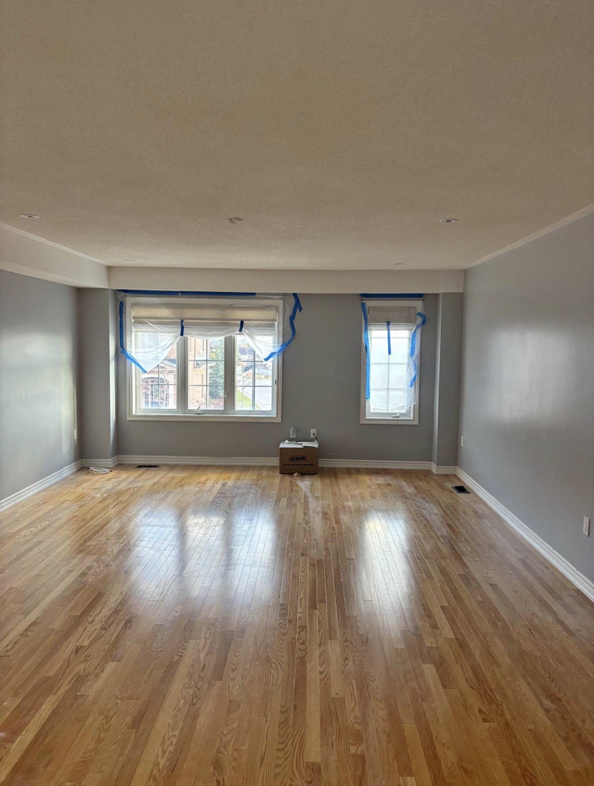 Completed living area with smooth finished walls and ceilings